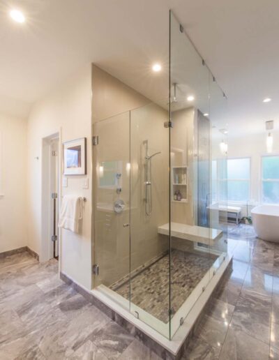 Full bathroom view with shower stall and tub