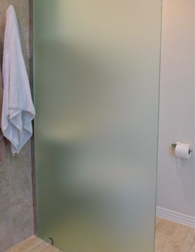 frosted glass privacy wall near the toilet
