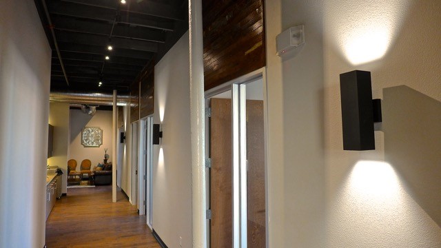 office space hallway with doors leading to conference rooms and private offices