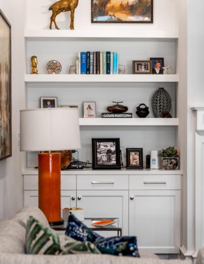 built-in bookshelves and white cabinetry in living room